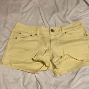 American Eagle yellow distressed shorts